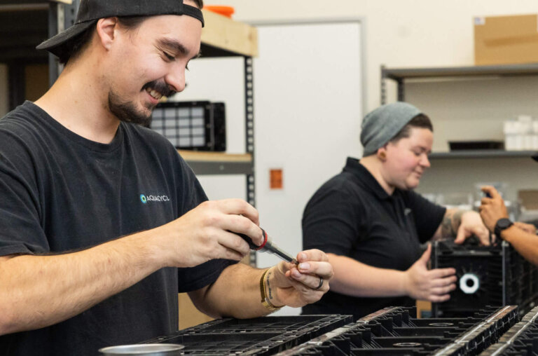 Technicians servicing a wastewater treatment system