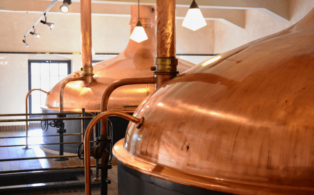 Treat distillery byproducts, copper tuns