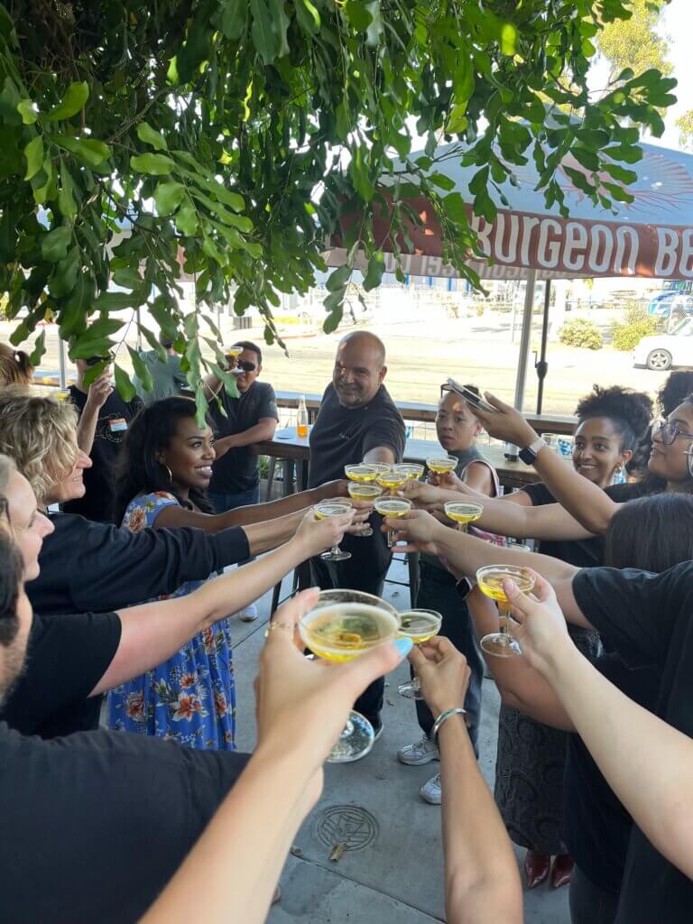 Aquacycl celebrating product launch with a toast