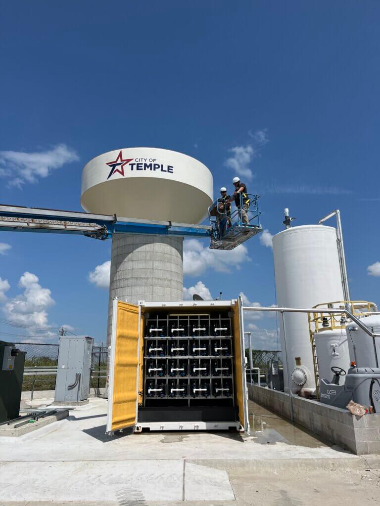 Aquacycl employees installing a new system